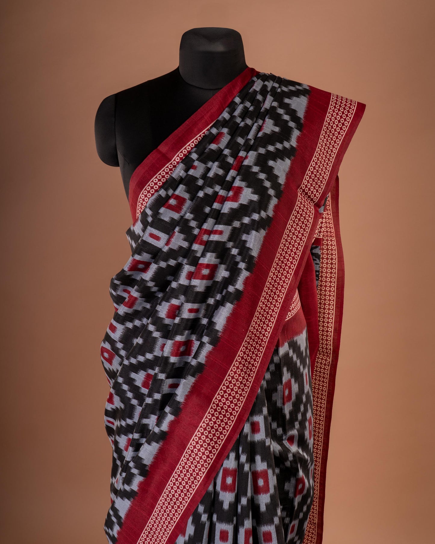 Bold Elegance in Every Drape - Handwoven Black Ikat Saree with Striking Red Accents