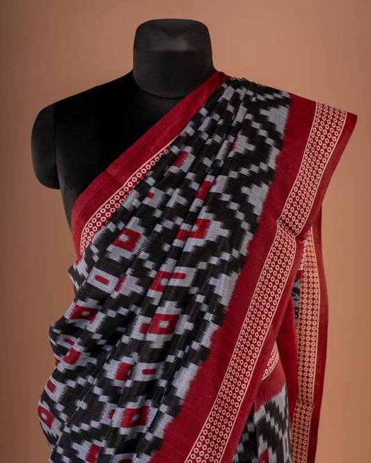 Bold Elegance in Every Drape - Handwoven Black Ikat Saree with Striking Red Accents