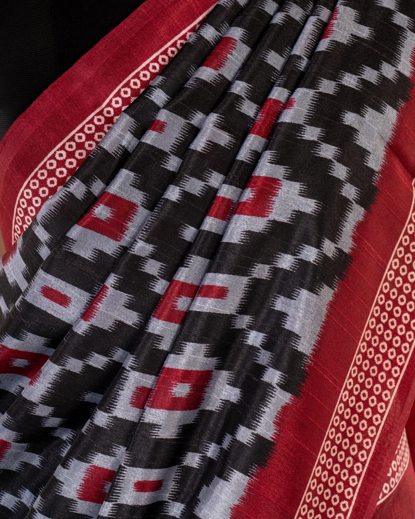 Bold Elegance in Every Drape - Handwoven Black Ikat Saree with Striking Red Accents